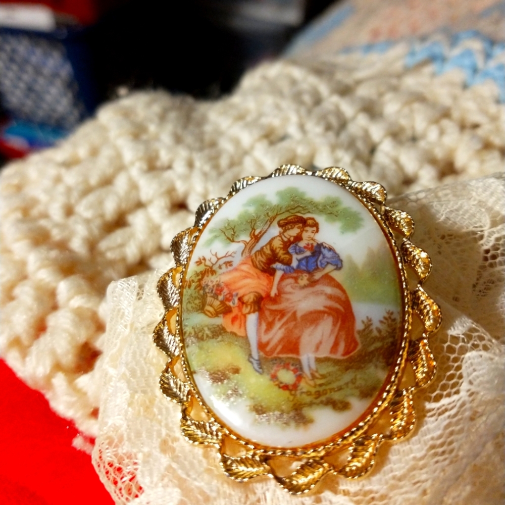 Vintage Limoges oval porcelain brooch. Fragonard courting couple in gold tone